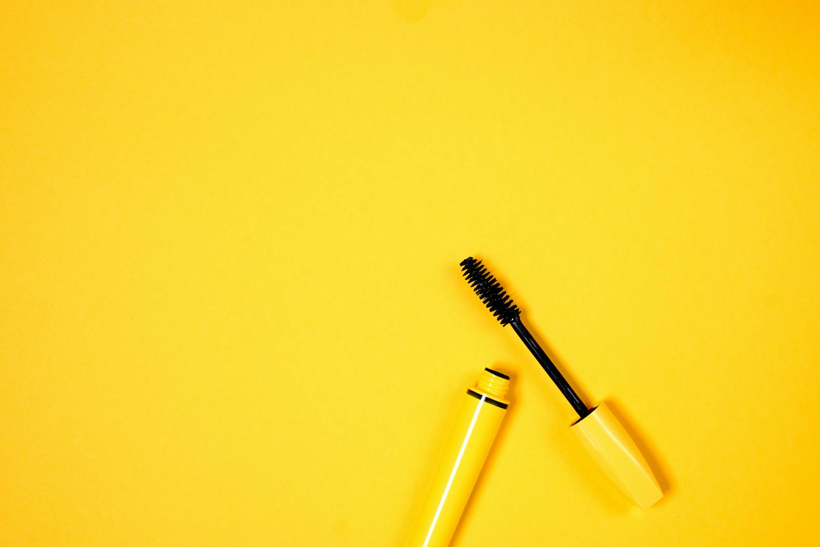 Yellow Mascara on Yellow Background