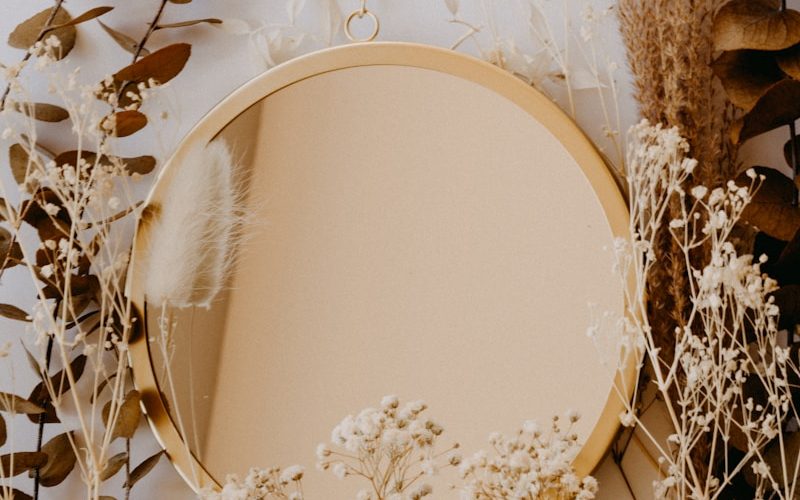 brown and white round mirror